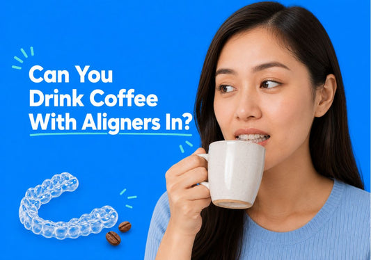  A woman bringing a coffee cup to her mouth with clear aligners in.