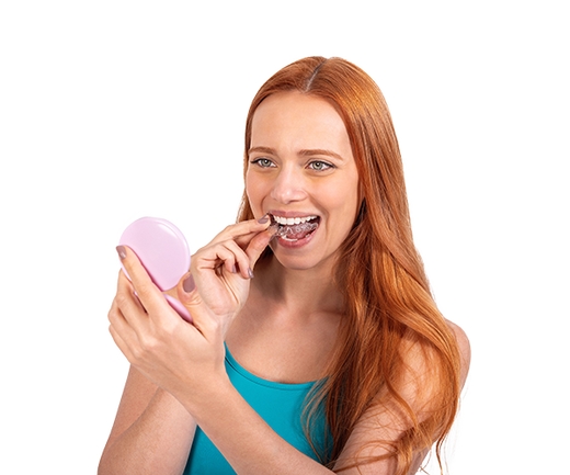 A girl putting on clear aligners.