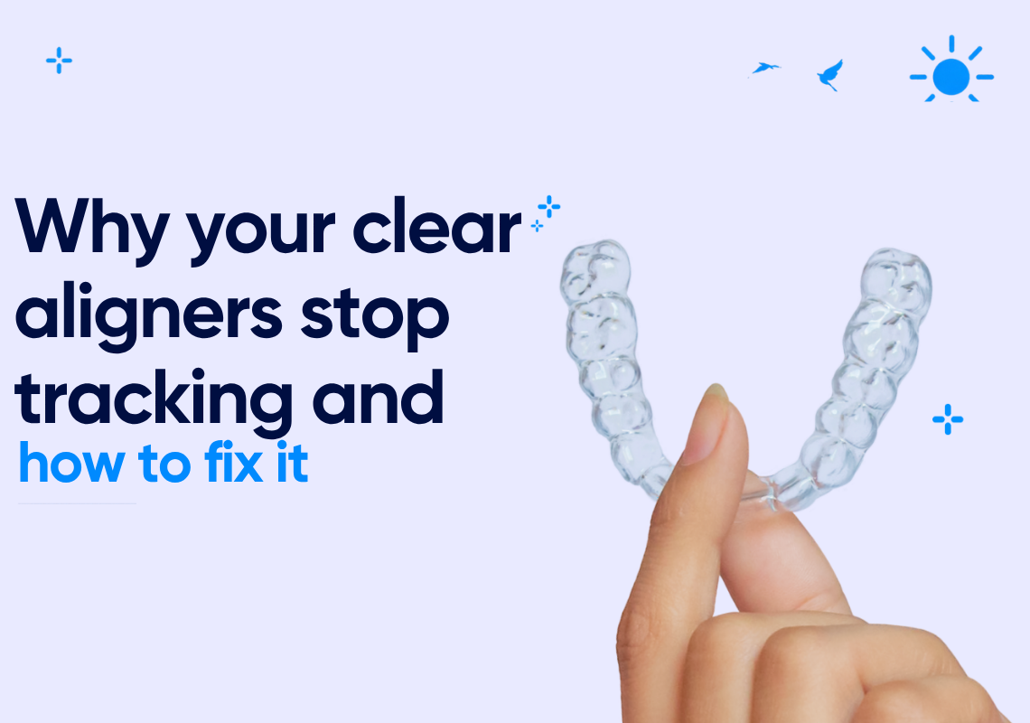 Hand holding a clear aligner tray.
