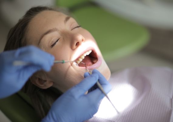 A patient undergoing a dental procedure after sedation